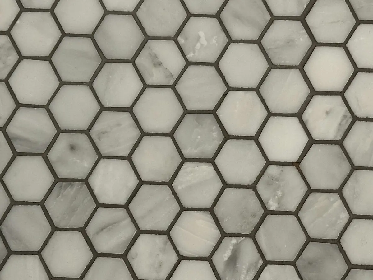 Close-up of mosaic floor tile and grout
